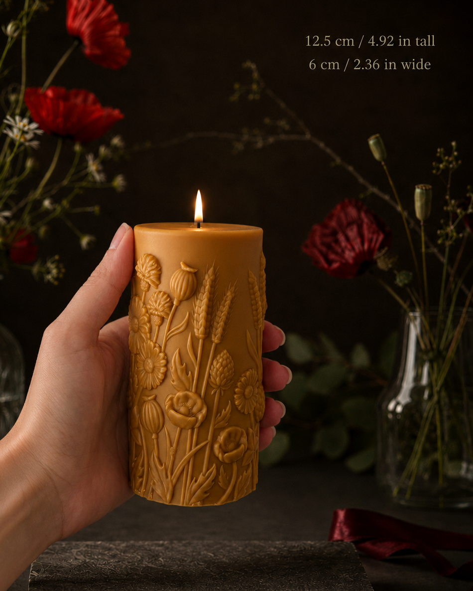 Wildflower silicone pillar candle mold – hand holding botanical candle with poppies and meadow blooms | Muse Molds